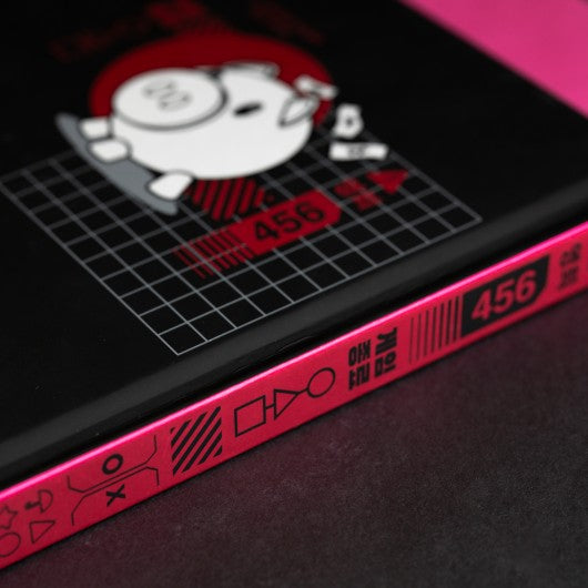 Lombada do caderno Squid Game com gráficos e elementos da série.