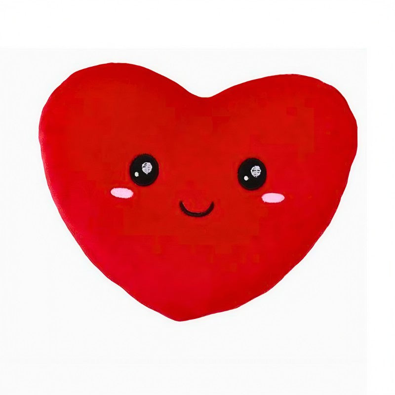 Almofada de peluche vermelha em forma de coração com expressão feliz. Um presente adorável para surpreender alguém especial.