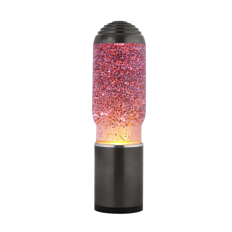 Lâmpada de Lava iTotal Glitter acesa, com glitter rosa e iluminação amarelo-alaranjada