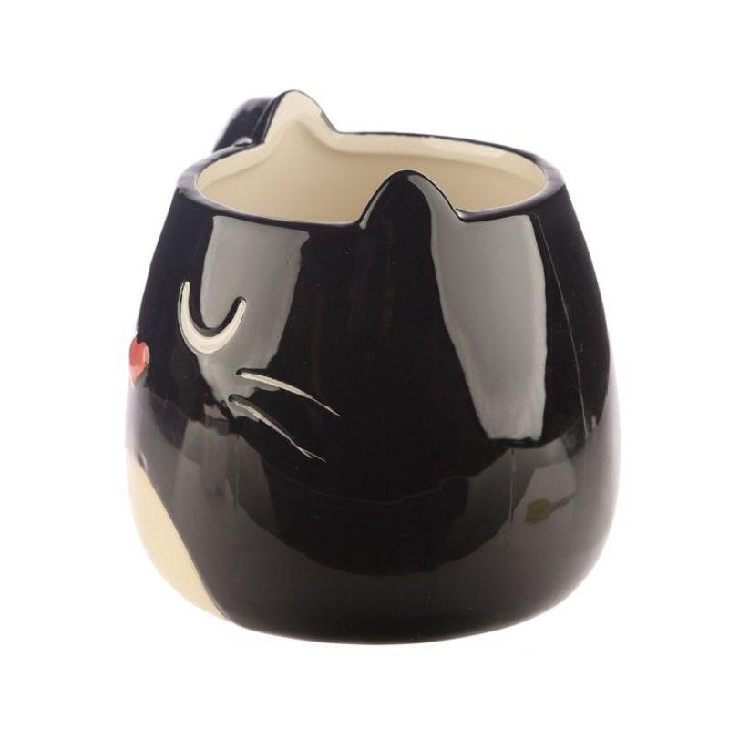 Vista lateral de uma caneca preta com o design de um gato, destacando-se as orelhas em forma ergonómica.