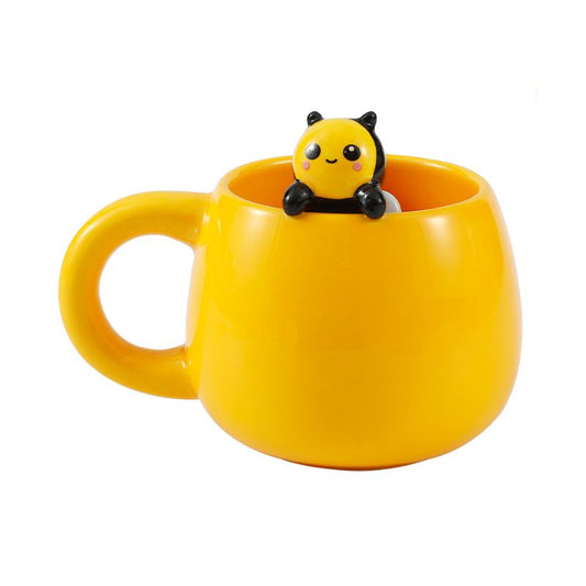 Caneca amarela com abelha sorridente a espreitar, vista frontal