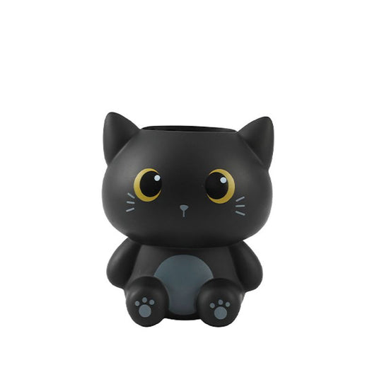 Porta-canetas 3D em forma de gato preto com olhos grandes e expressão adorável.